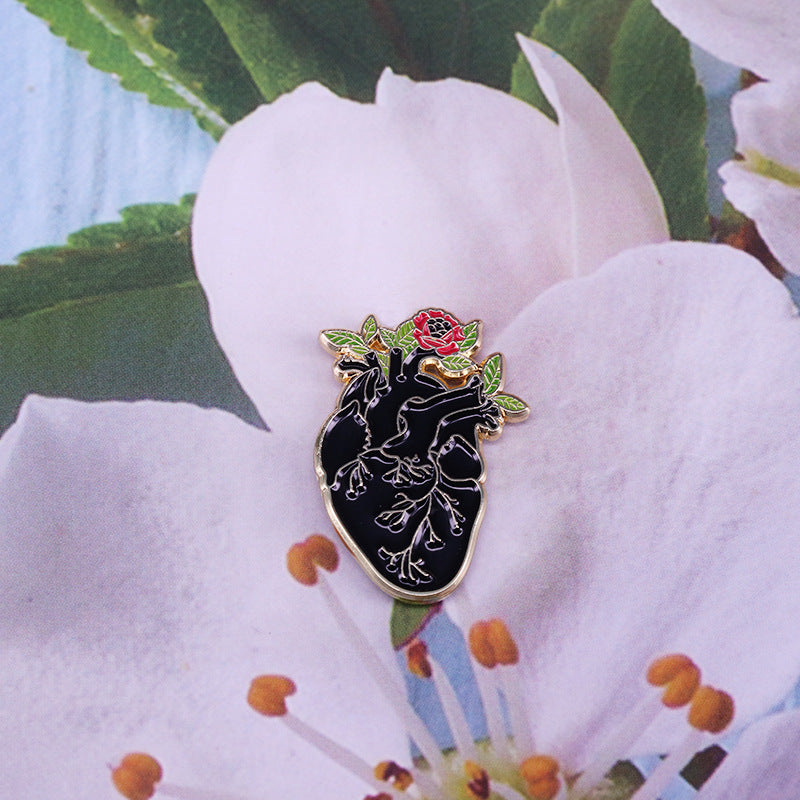 Black Anatomical Heart And Flowers Pin