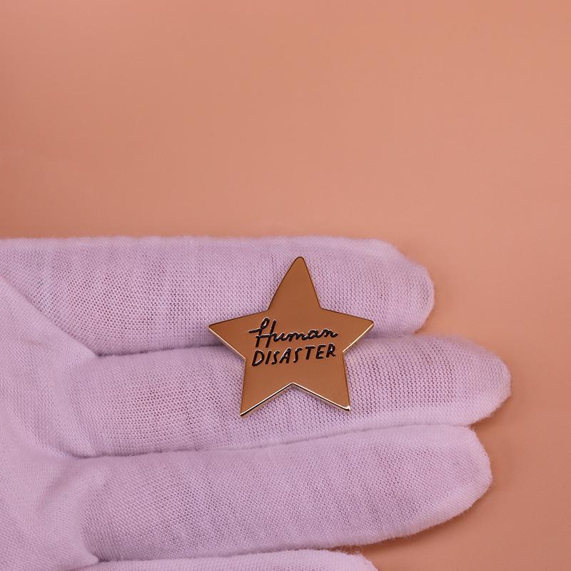 Human Disaster Pin